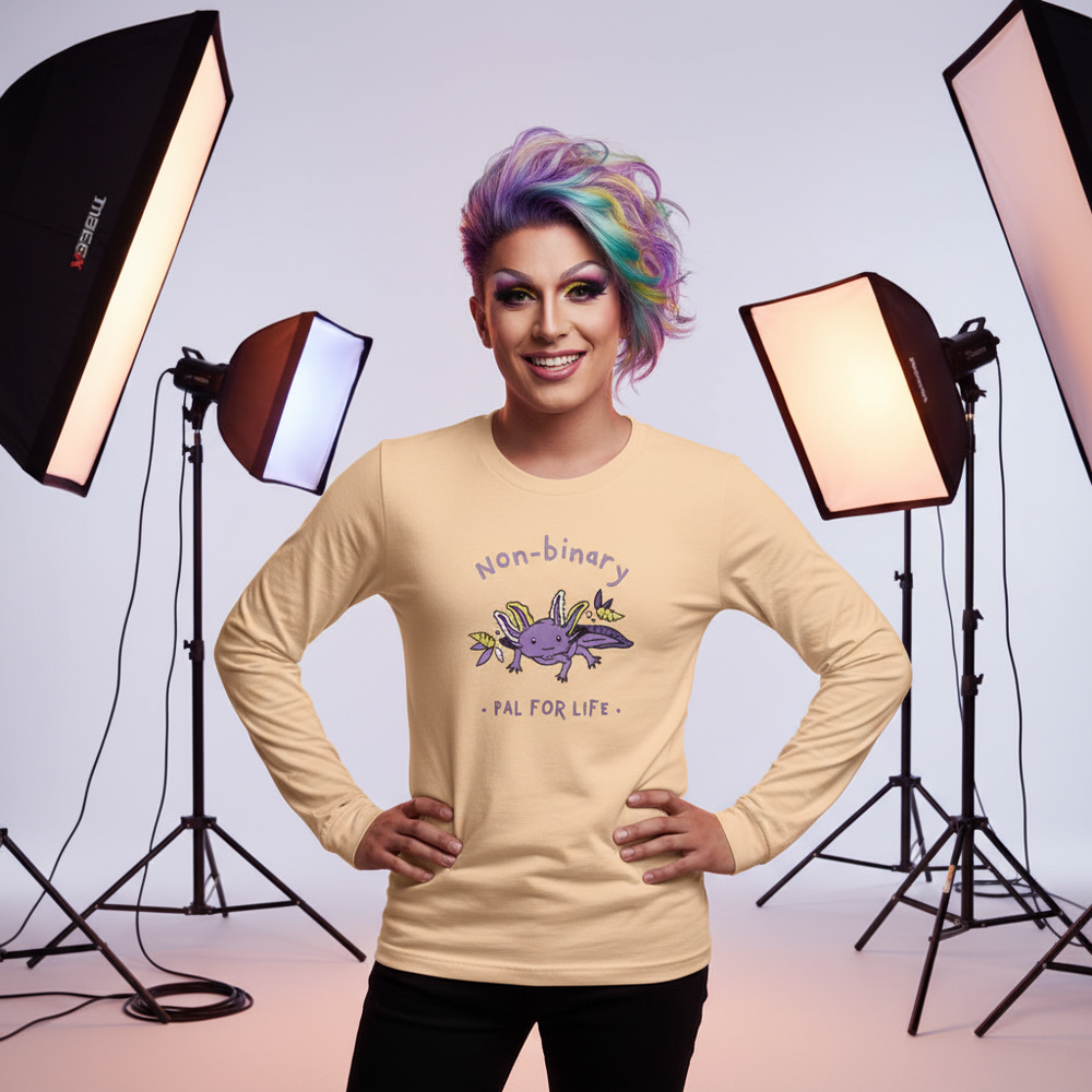 Model wearing a beige long-sleeve shirt reading “Non-binary Pal for Life” with an axolotl graphic
