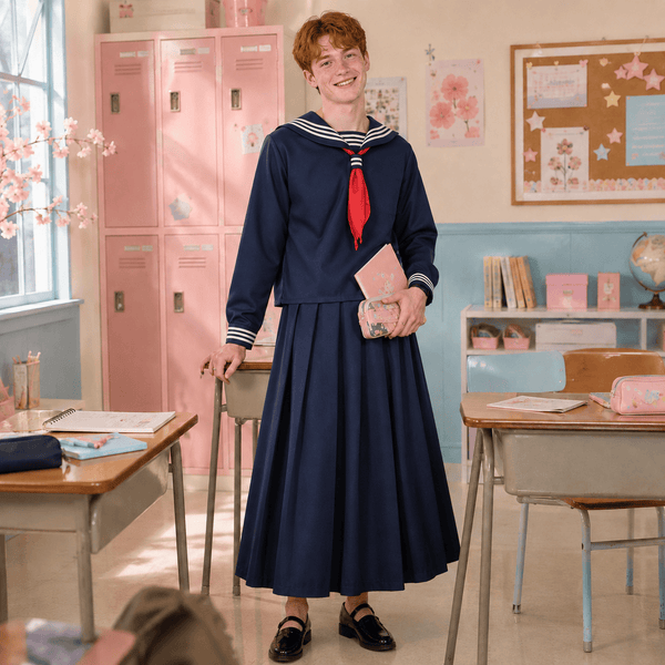 Model wearing a navy Japanese sailor-style student costume with red necktie in a classroom