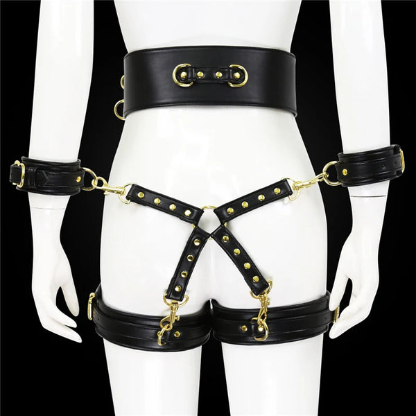 Front view of a black leather-look bondage harness set with wrist and thigh cuffs