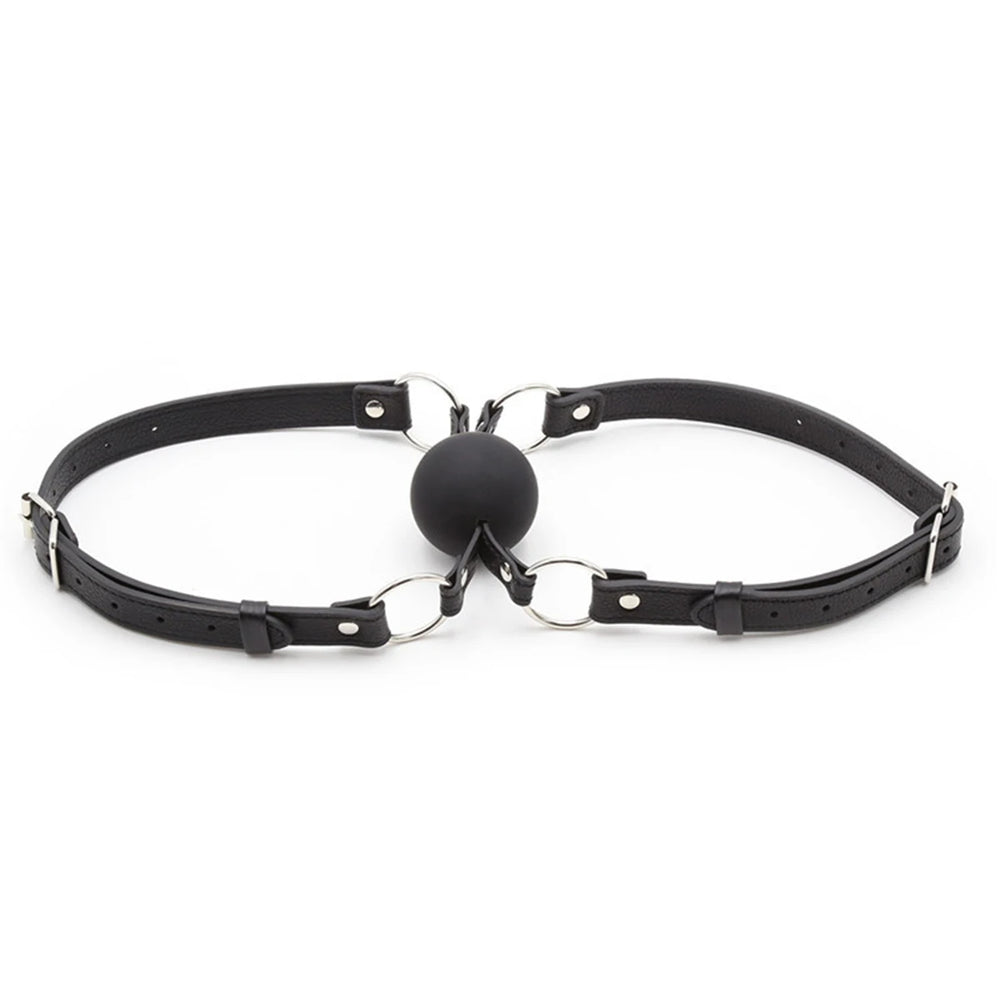 Black leather double-ball gag with adjustable straps, shown laid flat on white