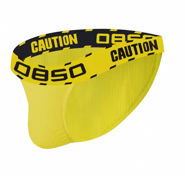 Yellow low-waisted briefs with black-and-yellow CAUTION tape waistband