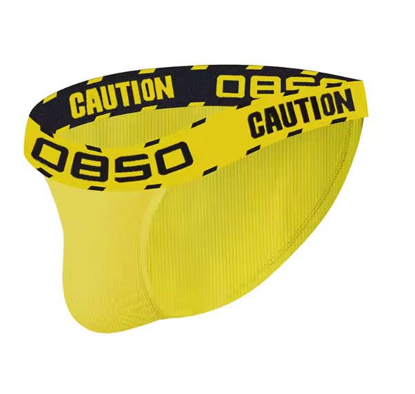 Yellow low-waisted briefs with black-and-yellow CAUTION tape waistband