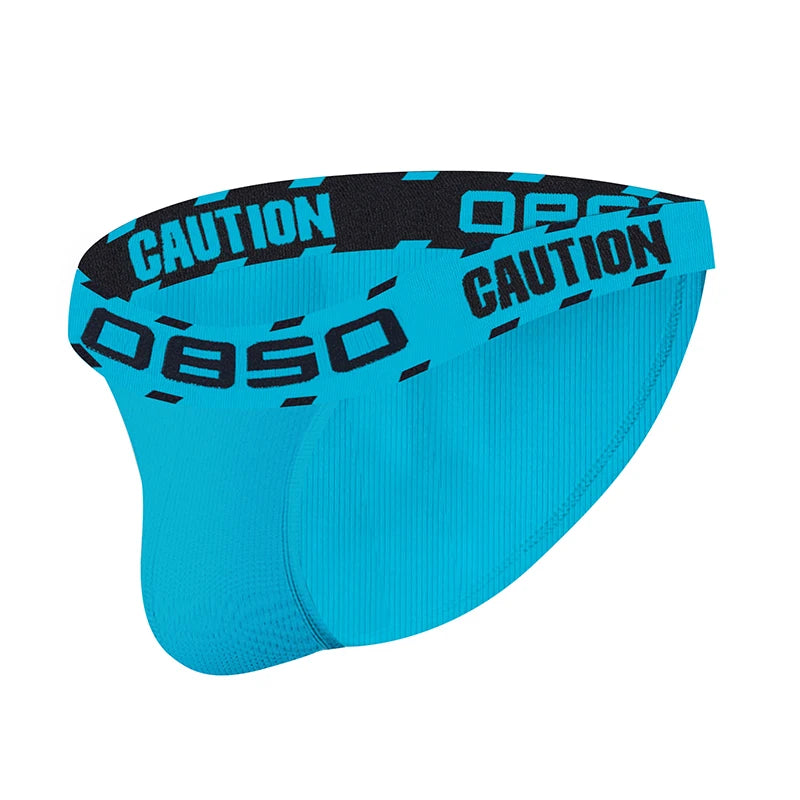 Turquoise low-waisted briefs with black “CAUTION” and “OBSO” waistband