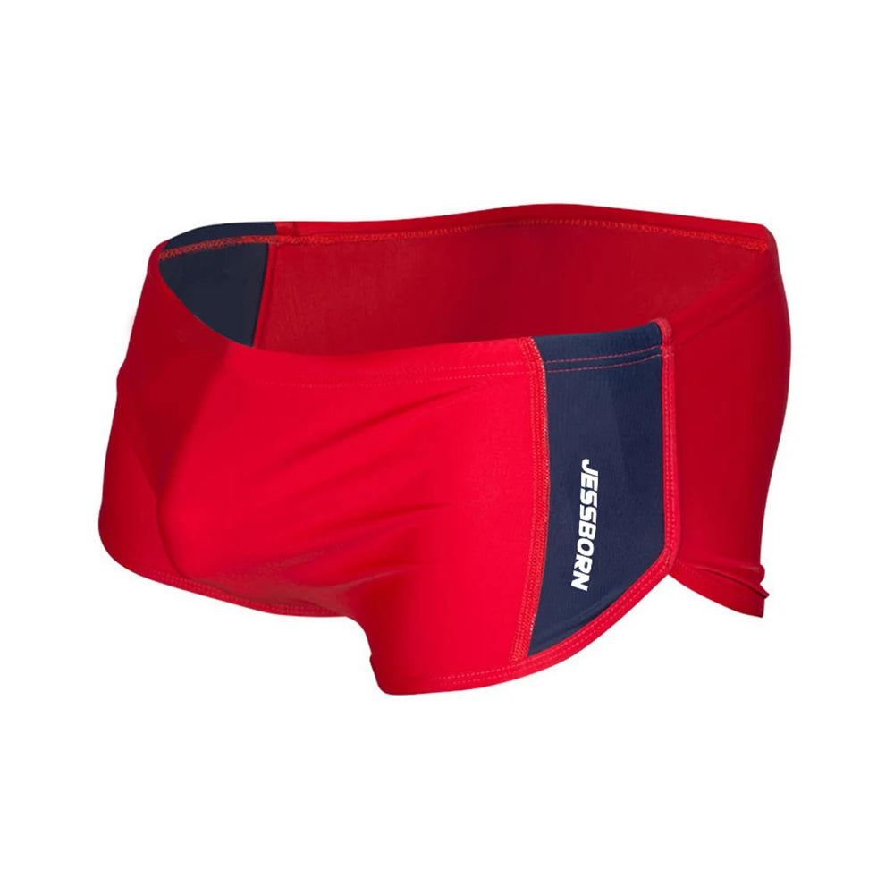 Red square-cut swim briefs with navy panels and JESSBORN lettering, shown from the front