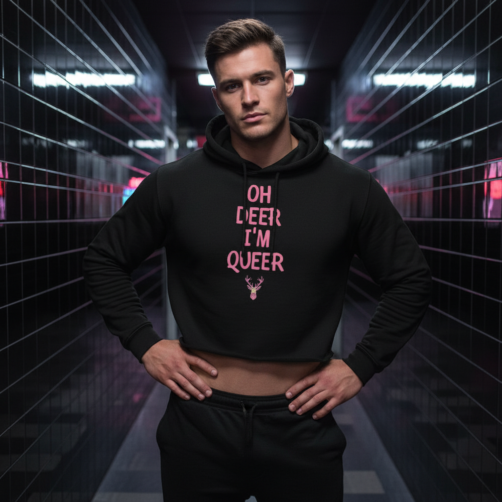 Model wearing a black cropped hoodie reading “OH DEER I’M QUEER”