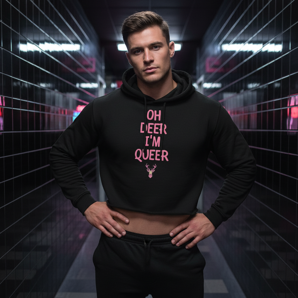 Model wearing a black cropped hoodie reading “OH DEER I’M QUEER”