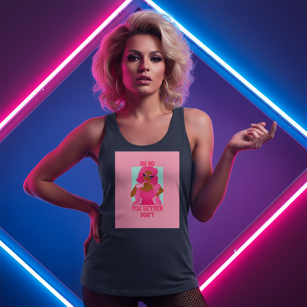 Unisex tank top with “OH NO YOU BETTER DONT” and a cartoon flamingo on a pink square, worn by a femme with big blond hair