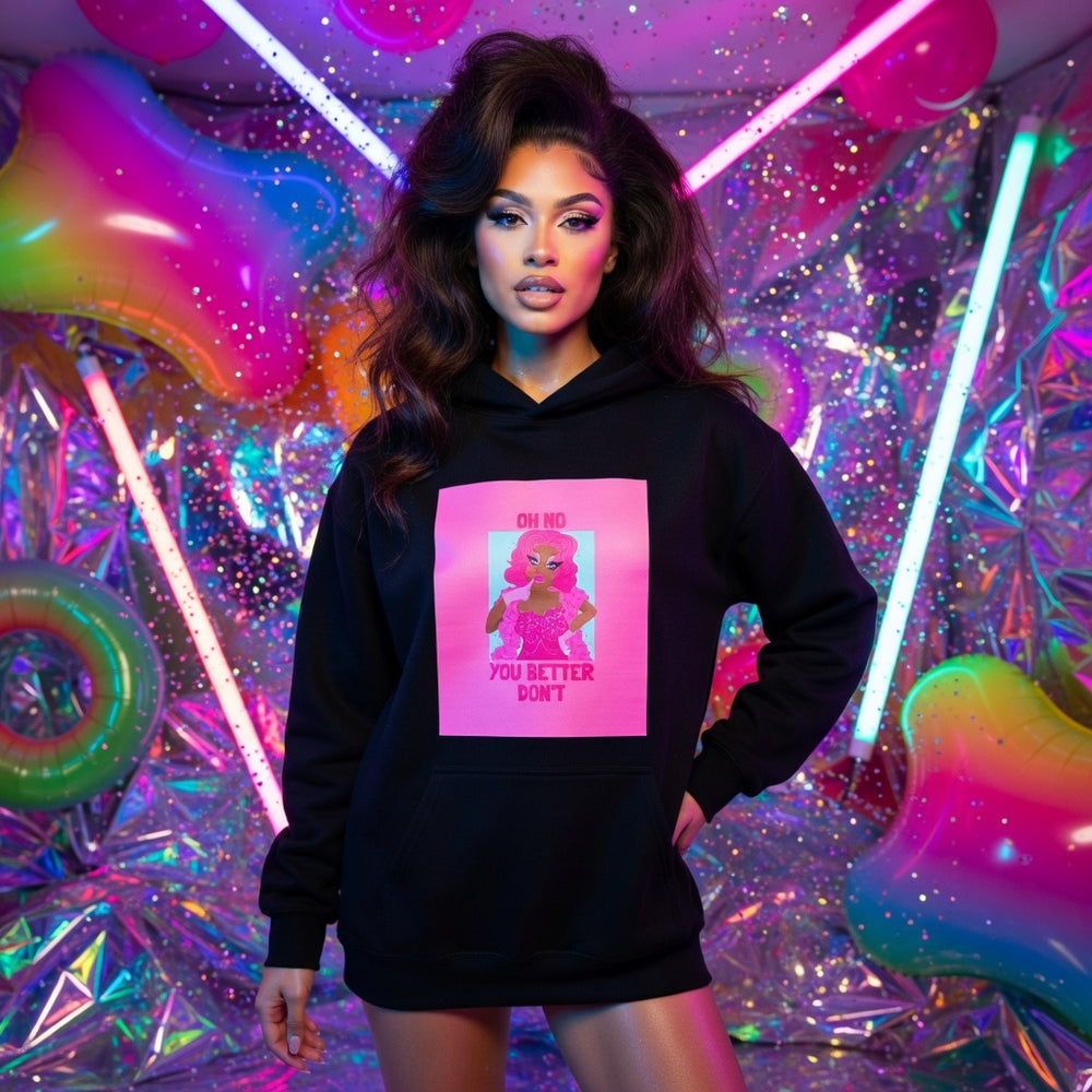 Oh No You Better Don’t Unisex Hoodie with pink cartoon graphic and sassy slogan, worn by a confident, queer-presenting babe.