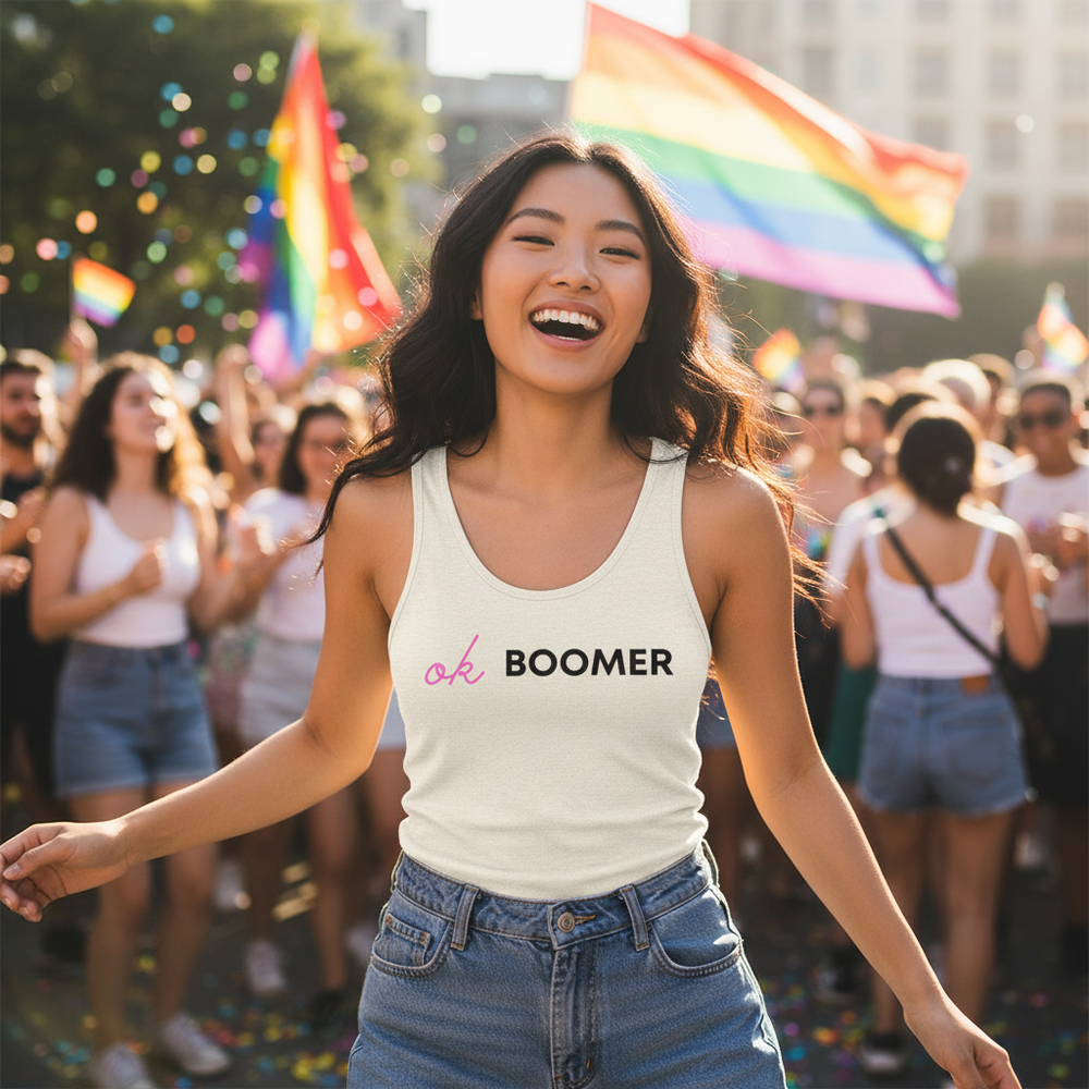 Ok Boomer Unisex Tank Top worn by a queer woman at a sunny Pride, rainbow flags waving and confetti in an inclusive crowd.