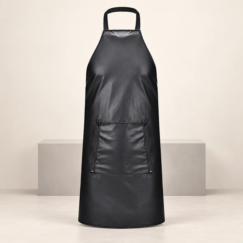 Front view of a black leather-look apron with neck loop and rectangular front panel, displayed against ivory.
