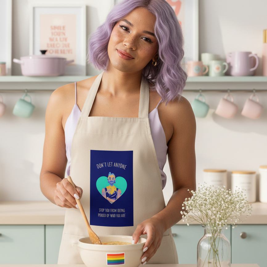 A person stirs batter while wearing the Don't Let Anyone Stop You From Being Proud organic cotton apron, featuring a heart design and empowering message, embodying prideful self-expression in the kitchen.