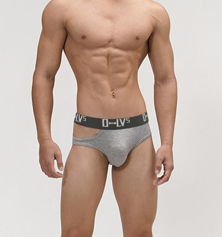Front-facing model wearing gray cut-out briefs with a black ORLVS waistband