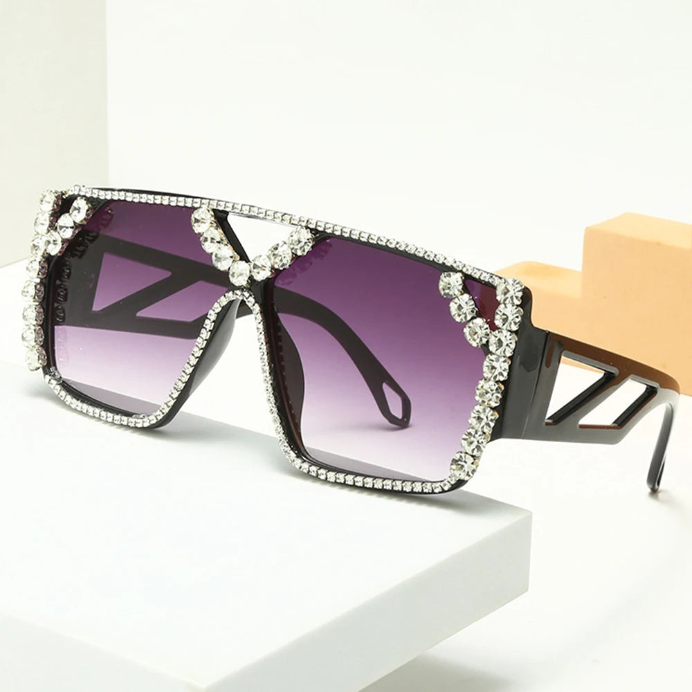 Oversized square sunglasses with purple gradient lenses and rhinestone-trimmed black frames