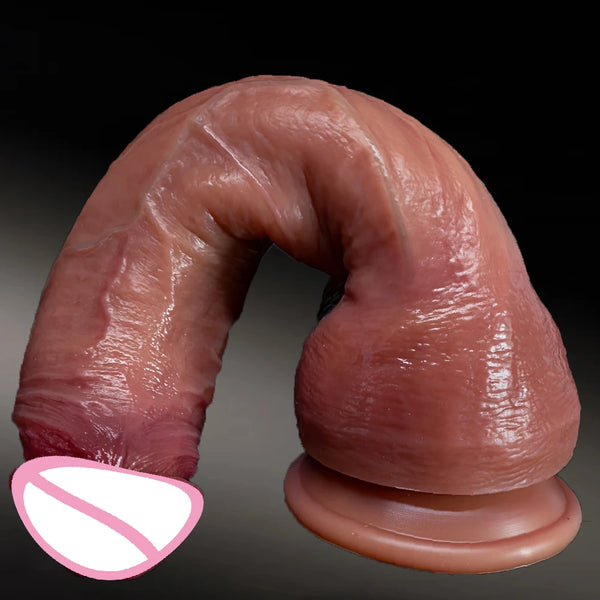 Close-up of a large curved, realistic flesh-toned dildo with a flared base