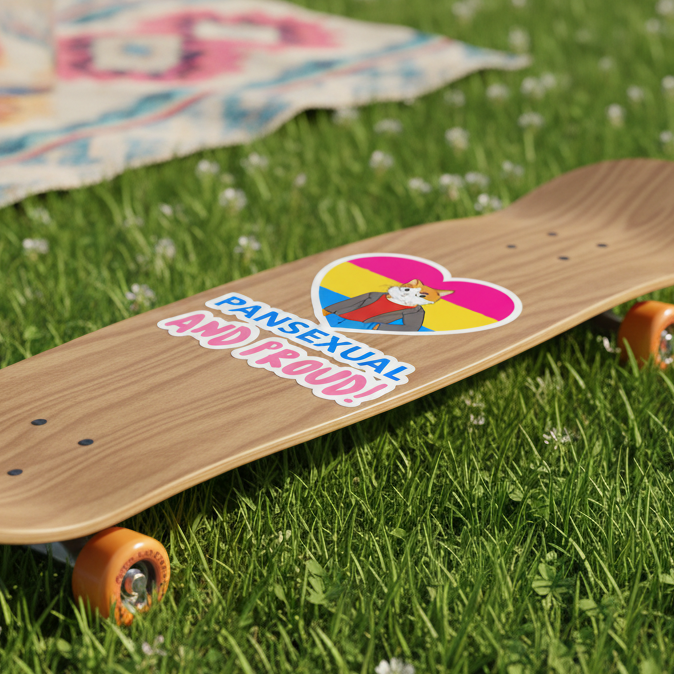 A skateboard with orange wheels on grass, repping a “Pansexual And Proud” sticker with a cartoon cat and pan flag heart