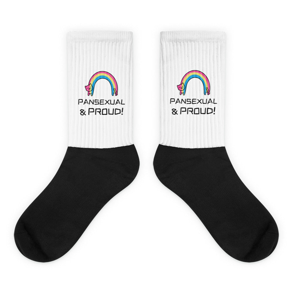 Pair of black-and-white ribbed socks with rainbow cats and “PANSEXUAL & PROUD!” text