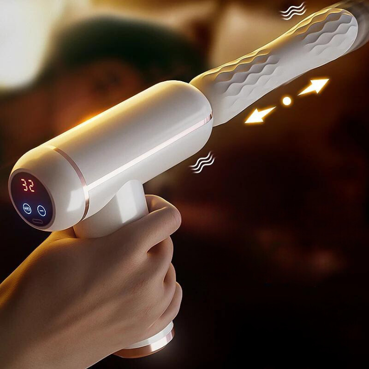Hand holding a white pistol-grip thrusting sex machine with a textured shaft and digital display