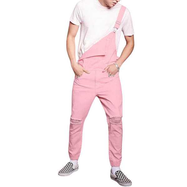 Front-view model wearing pink distressed overalls with one strap and tapered legs