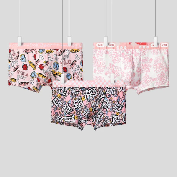 Three pink patterned boxer briefs hanging side by side, shown from the front