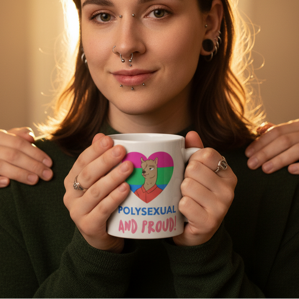 Close-up person holding a mug reading “POLYSEXUAL AND PROUD!” with a llama in a pride-colored heart