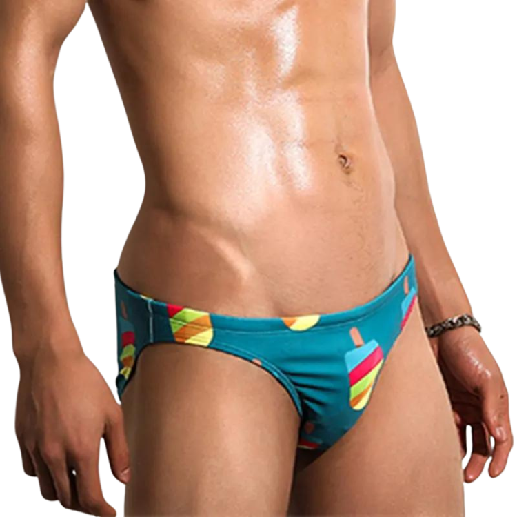 Front three-quarter view of a model wearing teal popsicle-print swim briefs