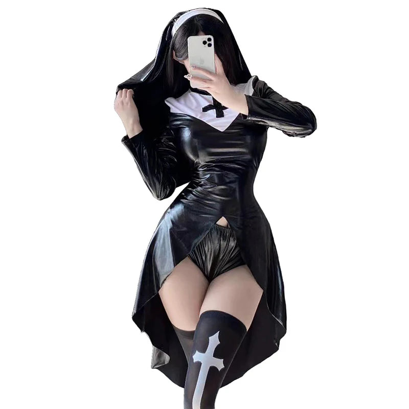 Model wearing a black glossy nun costume with white wimple, cross, briefs, and thigh-high socks