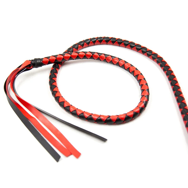 Red-and-black braided leather bullwhip coiled on a white background, with loose tails visible