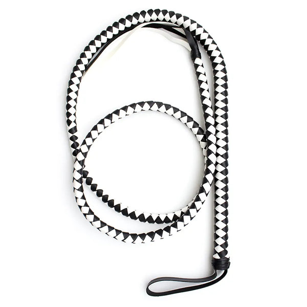 Coiled black-and-white braided bullwhip with a black wrist strap on a white background
