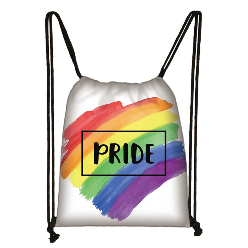White drawstring backpack with a rainbow brushstroke and “PRIDE” text