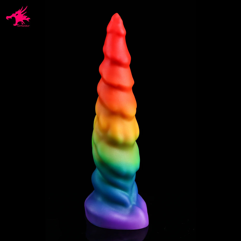 Rainbow silicone dildo standing upright, with a ridged tapered shaft and wide base
