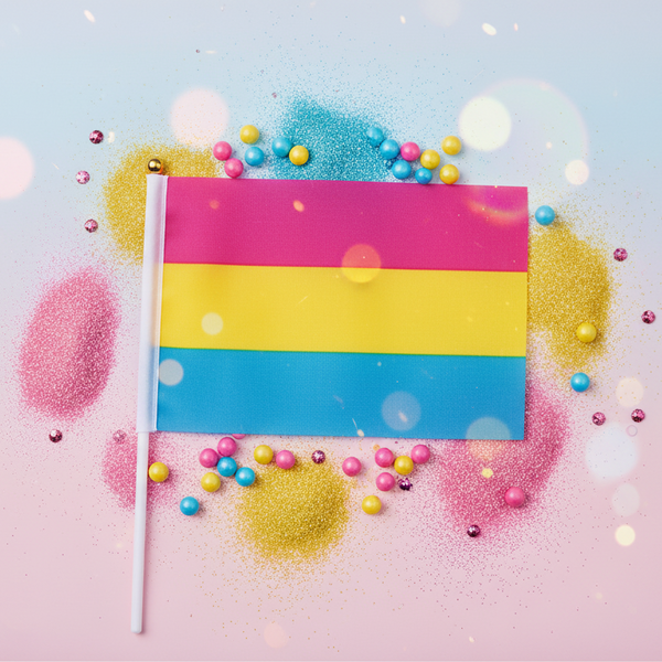 Hand-held pansexual Pride flag with pink, yellow, and blue stripes on a colorful confetti background