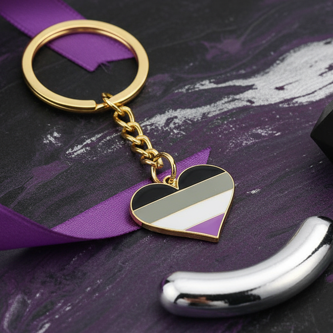Asexual Pride heart keychain with black, gray, white and purple enamel stripes
