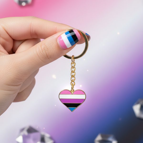 Genderfluid pride heart keychain held by a hand, with pink, white, purple, black, and blue stripes