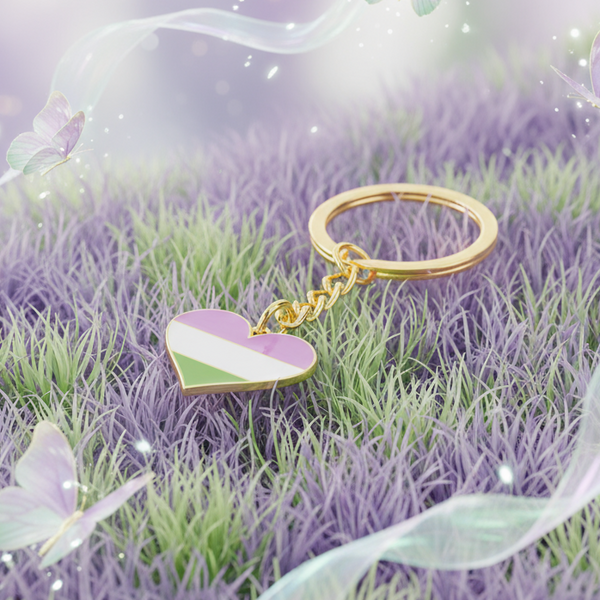 Genderqueer pride heart keychain with gold ring on lavender and green grass