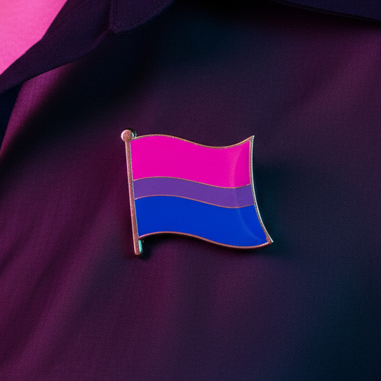 Bisexual pride flag enamel pin with pink, purple, and blue stripes on dark fabric