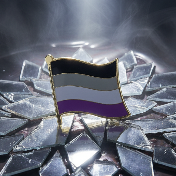 Asexual pride flag enamel pin displayed on shattered reflective glass