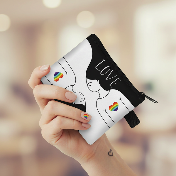 Hand holding a white love-themed coin purse with rainbow hearts, figures, and black zipper