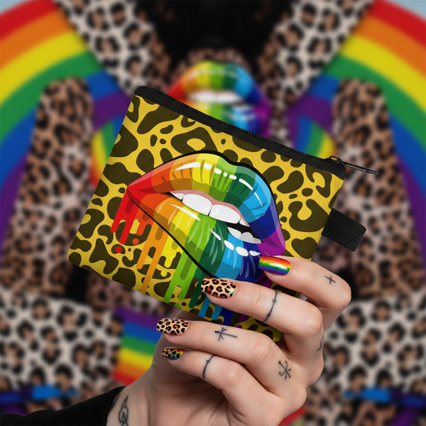 Leopard-print LGBT change purse with rainbow lips, held in a hand