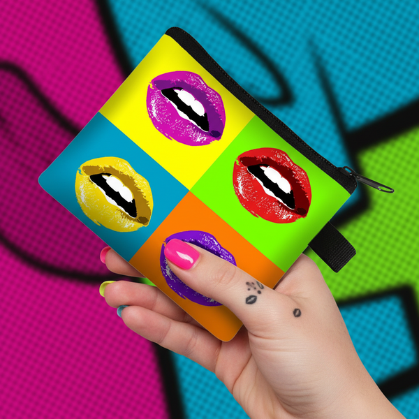 Pop art lips coin purse with colorful four-panel design, held by a hand