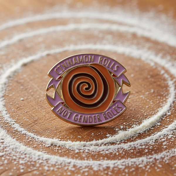 Cinnamon Rolls Not Gender Roles enamel pin with a cinnamon roll design on a flour-dusted surface