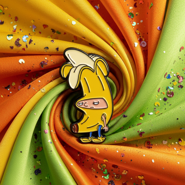 Yellow enamel pin depicting Hey Arnold’s Arnold in a banana suit
