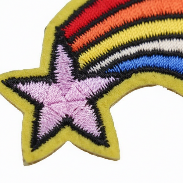 Close-up of a rainbow shooting-star embroidered iron-on patch