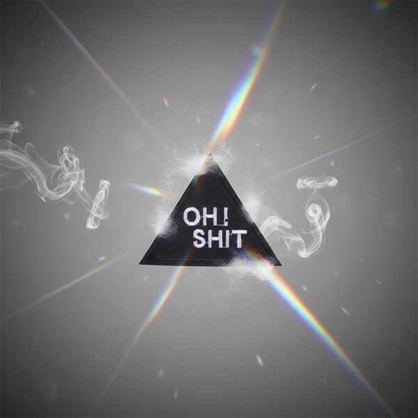 Black triangular embroidered patch reading “OH! SHIT” on a smoky background