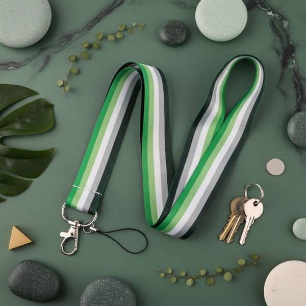 Aromantic Pride lanyard with green, gray, black, and white stripes beside keys