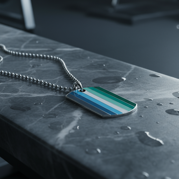 Striped blue, white, and green tag necklace lying on a wet dark tabletop