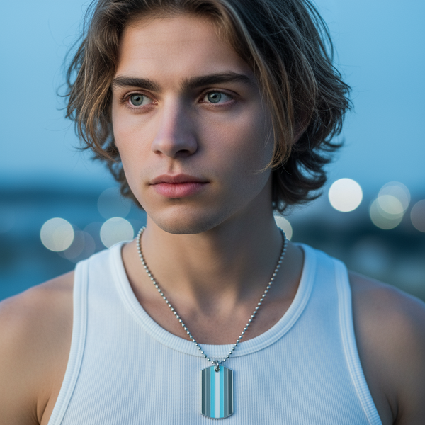 Close-up model wearing a striped blue-and-gray pride tag necklace on a ball chain