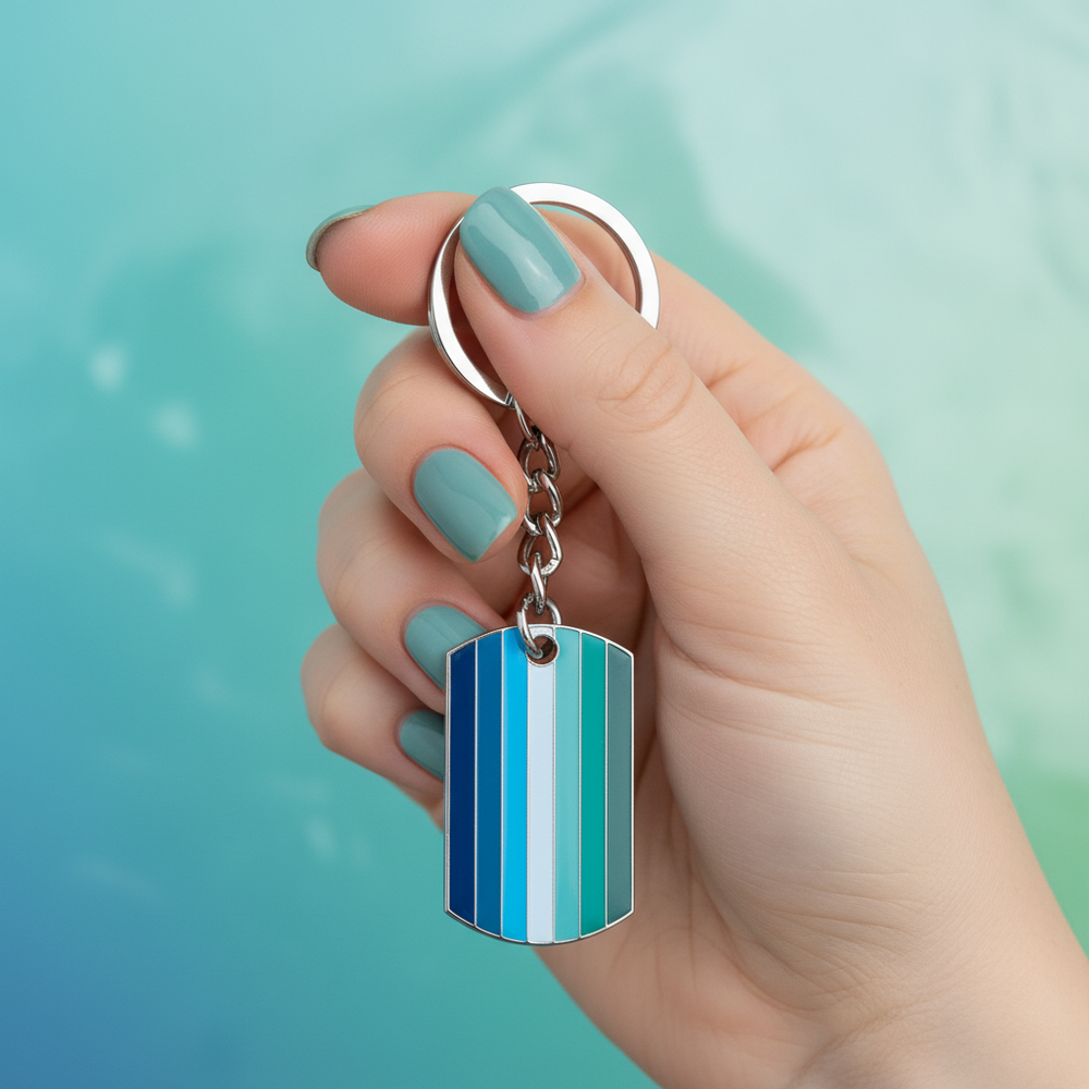 Gay male pride keychain with blue, teal, white, and green striped rectangular charm