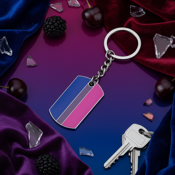 Bisexual pride keychain with blue, purple, and pink stripes beside keys