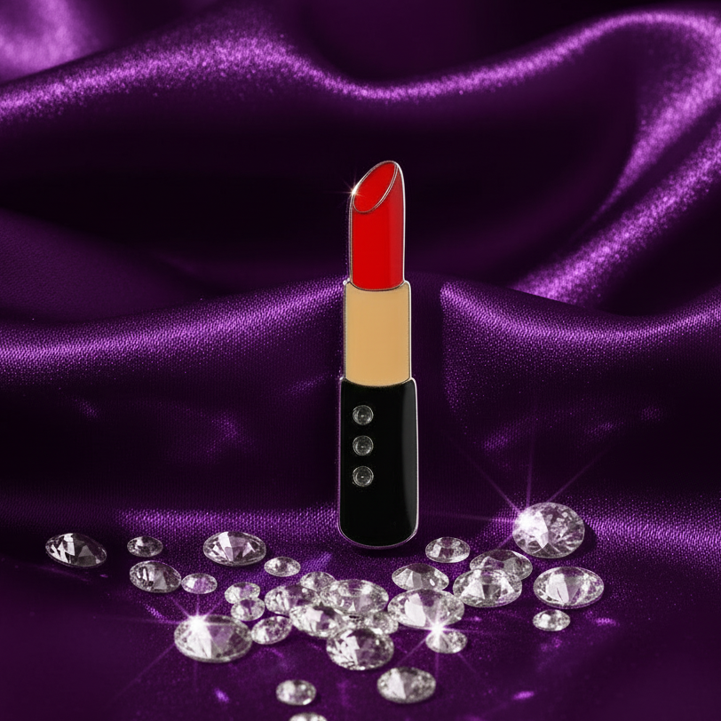 Lipstick enamel pin with red lipstick and rhinestone details on purple satin
