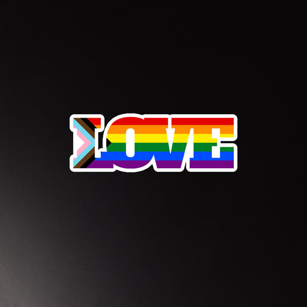 Progress Pride rainbow magnet spelling “LOVE” on a black background